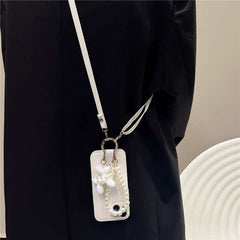 Camellia Flower and Puppy Pearl Charm Leather Crossbody Lanyard Phone Case for iPhone 14 Series